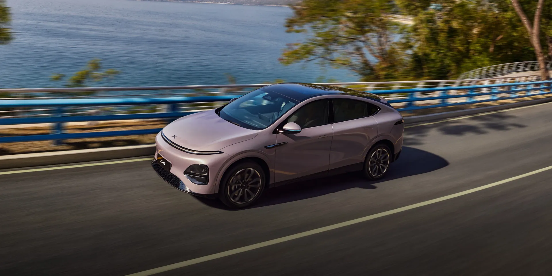 XPeng G6 electric SUV driving on a coastal road